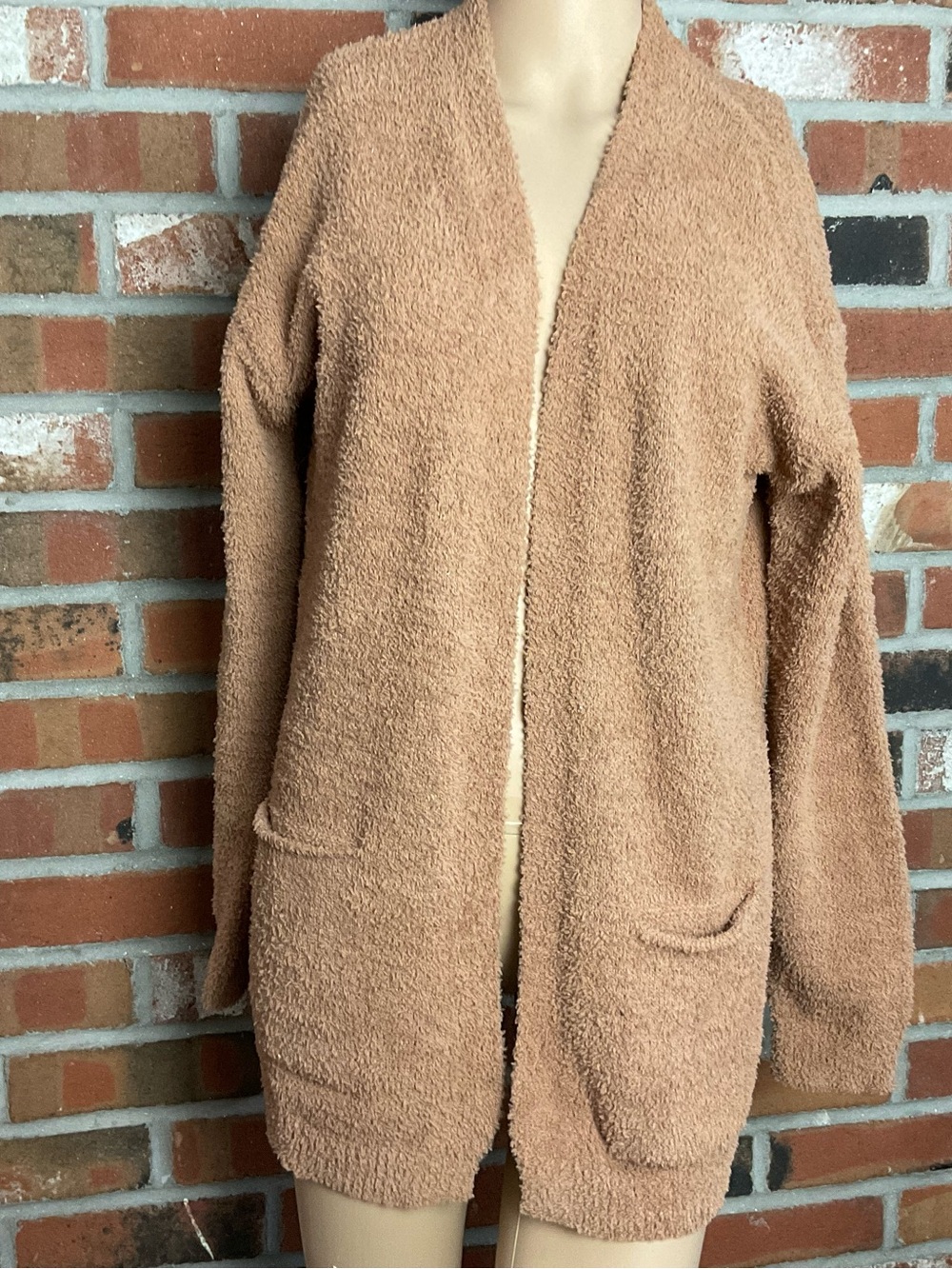 Morrisseys sweater coat with 2 front pockets in a tobacco color